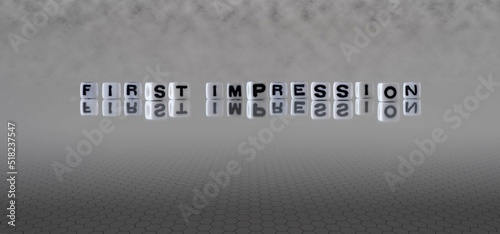 first impression word or concept represented by black and white letter cubes on a grey horizon background stretching to infinity