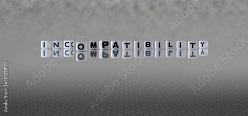 Принти на полотні incompatibility word or concept represented by black and white letter cubes on a