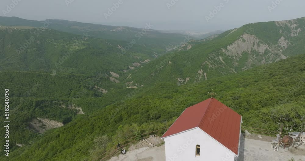 Aerial shot revealing a small Orthodox church in the middle of wilderness. Aerial shot revealing a small Orthodox church in the middle of wilderness.