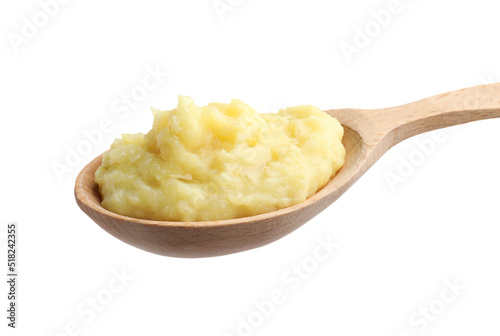 Wooden spoon of tasty mashed potatoes isolated on white