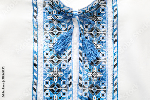 Beautiful white shirt with light blue Ukrainian national embroidery, top view
