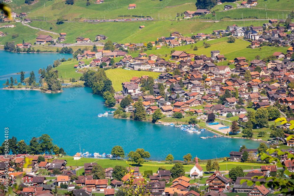 Lungern turquoise lake and village , canton of Obwalden in Switzerland