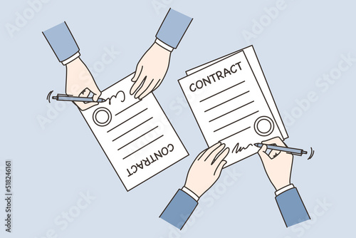 Business partners sign contract at meeting 