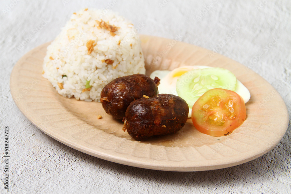 Freshly cooked Filipino food called Longsilog or cured pork sausage, egg and fried rice Freshly cooked Filipino food called Longsilog or cured pork sausage, egg and fried rice