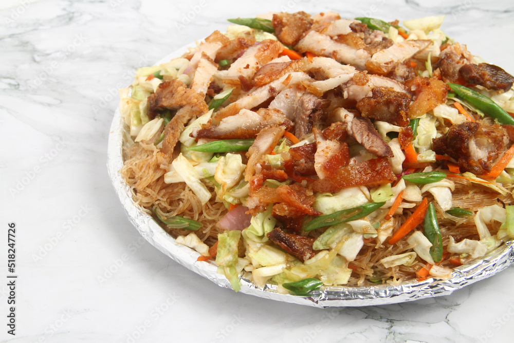 Freshly cooked Filipino food called Pancit Bihon with Lechon Freshly cooked Filipino food called Pancit Bihon with Lechon