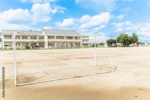 田舎の小学校のサッカーゴールと青空 photo