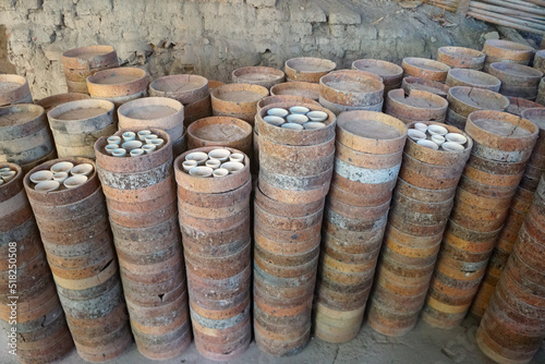 Saggar or Jock is a container of Chicken bowls for protecting flame and ashes from fuel during firing in the kiln. How to make the traditional ceramic pottery.