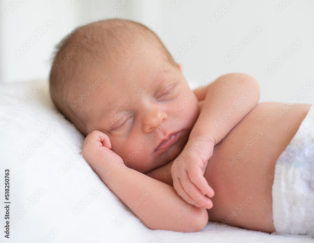Newborn sleeping soundly and peacefully on white blanket. Birth baby - happiness for family. New worries and style life. Concept of child care, feeling safe, parent love. Newborn sleeping soundly and peacefully on white blanket. Birth baby - happiness for family. New worries and style life. Concept of child care, feeling safe, parent love.