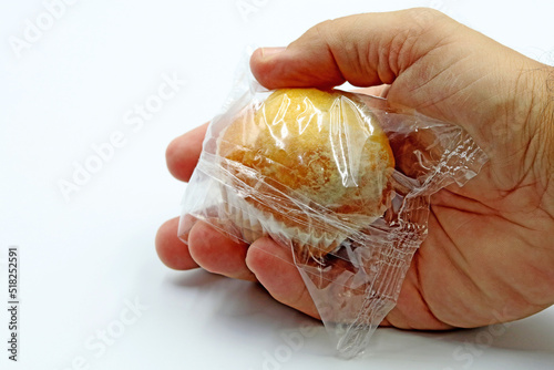 A fungus-contaminated cupcake. Concept of food safety and food poisoning photo