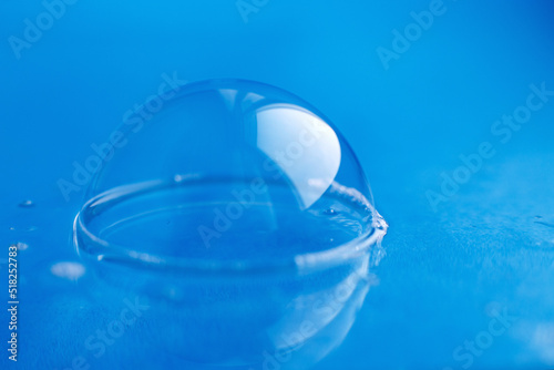 soap bubble close up. abstract blue water background