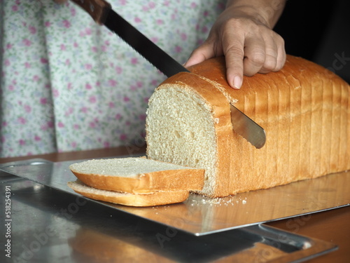 Fototapeta cutting white sandwich bread