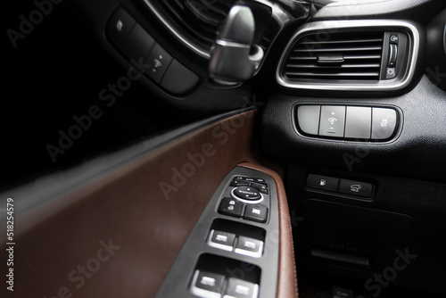 AC ventilation deck in luxury modern car Interior. Modern car red leather interior. Natural carbon panel. Perforated leather. Car interior. © Aleksei