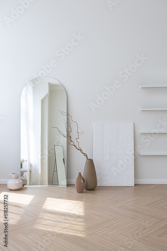 super white simple clean and stylish interior with modern furniture in nude color and contrasting black elements. luxury design of a large bright room living room