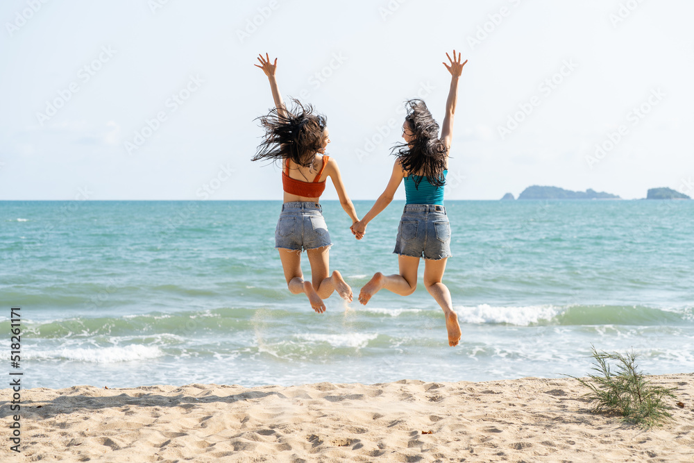 Asian beautiful young women having fun, playing on the beach together. Attractive woman friends feeling happiness and fun while running at seaside enjoy vacation holiday trip in tropical sea island. Asian beautiful young women having fun, playing on the beach together. Attractive woman friends feeling happiness and fun while running at seaside enjoy vacation holiday trip in tropical sea island.