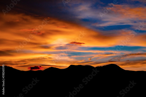 Sunset over the mountains. A colorful scene of sunset over a set of hill range.