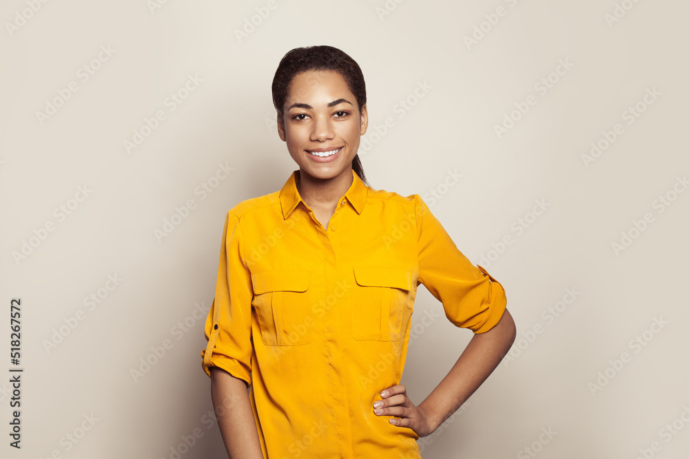 Happy young black woman student smiling on white background Happy young black woman student smiling on white background