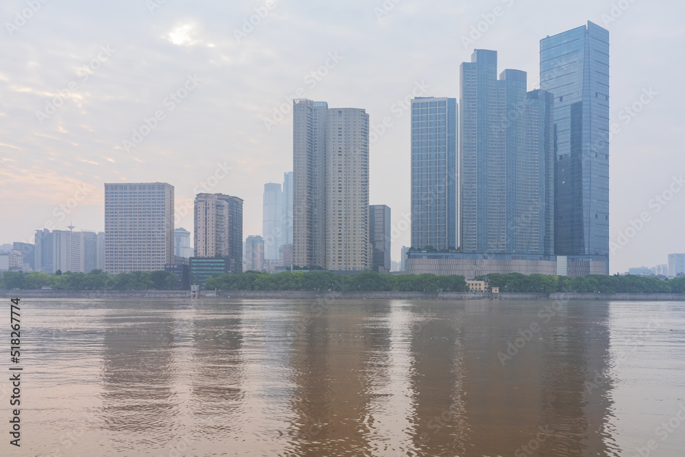 The skyline of urban buildings and the scenery of the Yangtze River in Changsha, Hunan Province, China