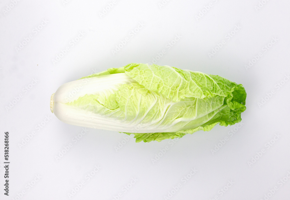 A green fresh baby cos (lettuce) isolated on white background A green fresh baby cos (lettuce) isolated on white background