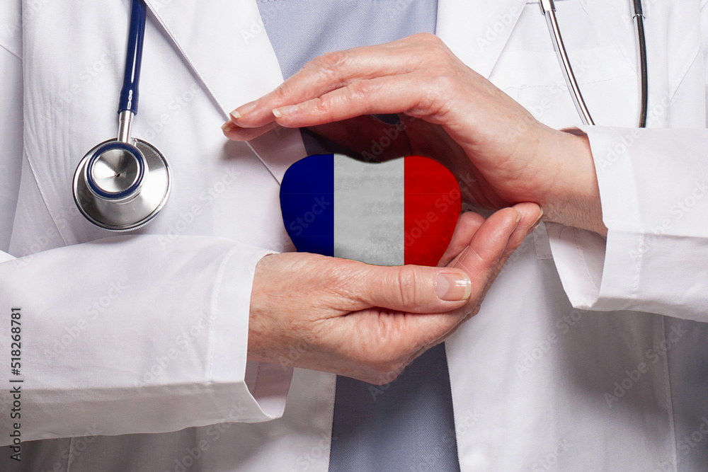 French doctor holding heart with flag of France background. Healthcare,  charity, insurance and medicine concept Photos | Adobe Stock