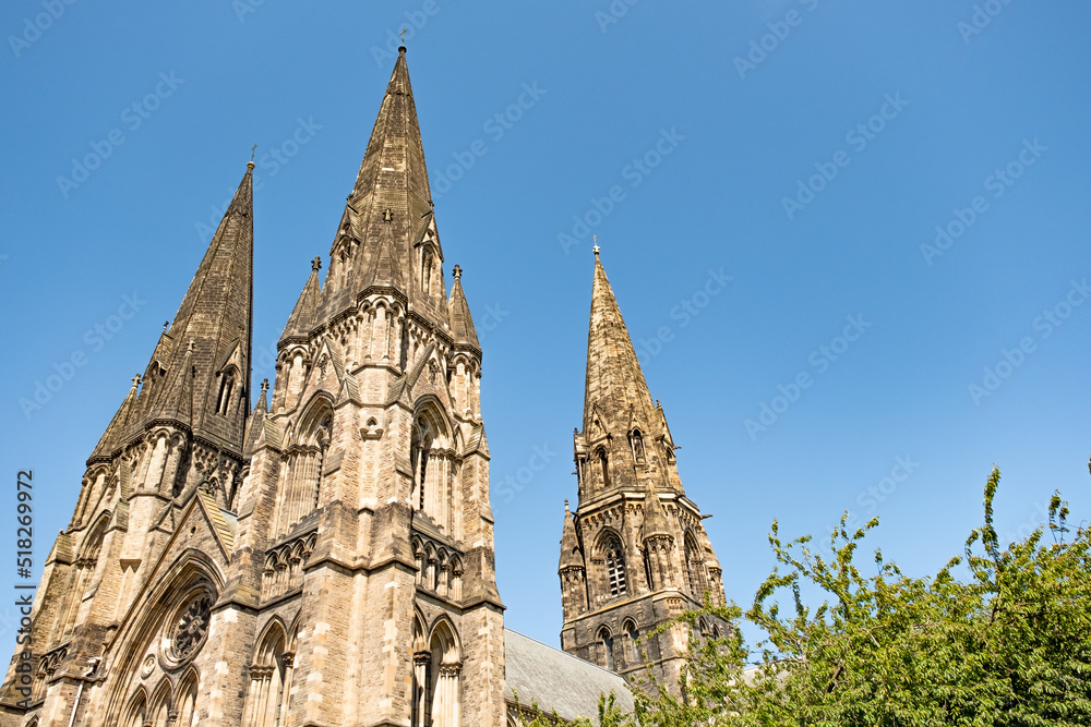 Historical and ancient city centre church or cathedral spire on a bright and sunny day