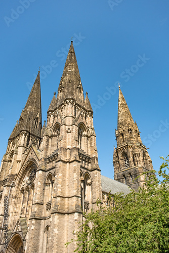 Historical and ancient city centre church or cathedral spire on a bright and sunny day