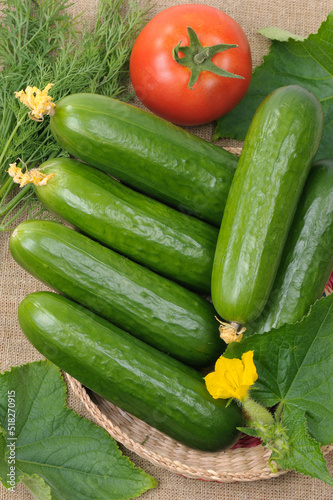 Several fresh cucumbers in a basket