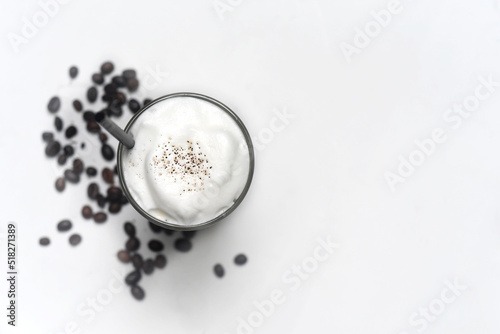 Ice latte with coffee beans isolated on white background