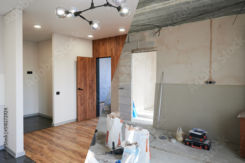 Comparison of old room with building tools and new renovated room. Photo collage of apartment before and after restoration. Concept of home renovation.