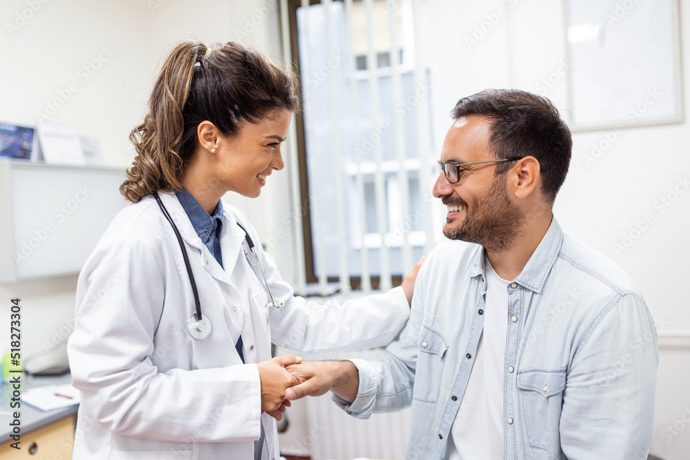 Young woman doctor or GP in white medical uniform consult male patient in private hospital. Female therapist speak talk with man client on consultation in clinic. Young woman doctor or GP in white medical uniform consult male patient in private hospital. Female therapist speak talk with man client on consultation in clinic.