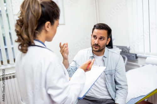 Young female professional doctor physician consulting patient  talking to adult man client at medical checkup visit. diseases treatment. medical health care concept