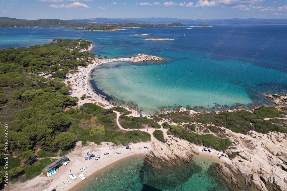 aerial view of the sandy Karydi beach in the resort village of Vourvourou in Greece. Beautiful clear blue sea with the scenic beaches of Halkidiki. High quality photo