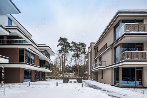 Modern exterior of new luxury residential building at winter.