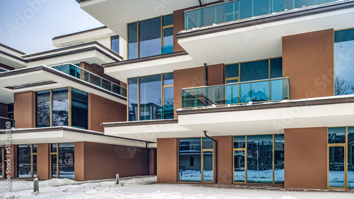 Modern exterior of new luxury residential building at winter.