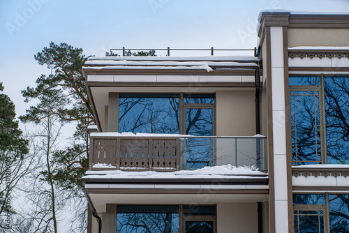 Modern exterior of luxury private house. Part of facade.  Balcony.