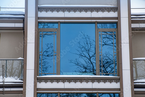 Modern exterior of luxury private house. Part of facade. Window.