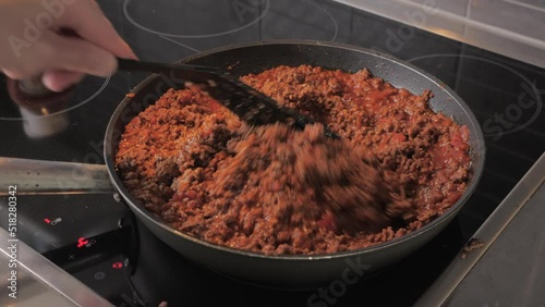 Chef stir and fry minced meat in a frying pan