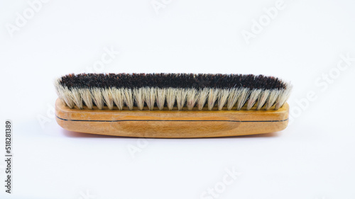 Wooden shoe brush horsehair brush for leather shoe polishing on white background