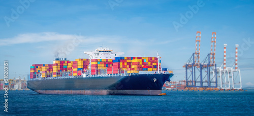 Photography cargo ship and truck at seaport waiting for container dock crane shipment harbor loading container import and export commercial trade business logistic and transportation international