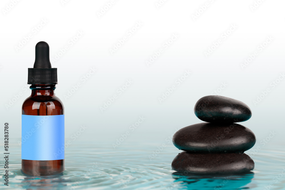 Medicinal product in a bottle with a dropper, mock-up. Balance and harmony, concept. Cosmetic container mock-up. Creative minimalistic shot of a cosmetic product. Medicinal product in a bottle with a dropper, mock-up. Balance and harmony, concept. Cosmetic container mock-up. Creative minimalistic shot of a cosmetic product.