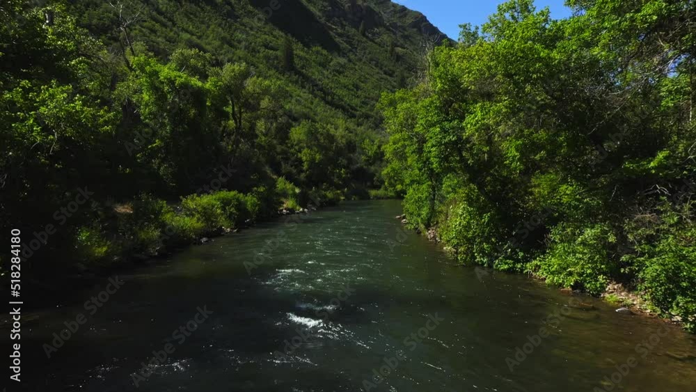 Aerial down a flowing river in Provo Utah. Aerial down a flowing river in Provo Utah.