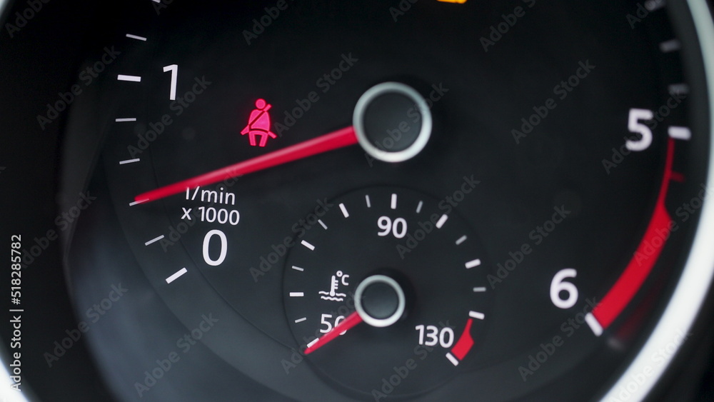 Starting car engine. Dashboard in the car. Tachometer Gauge of Starting and Stopping Car Close Up.