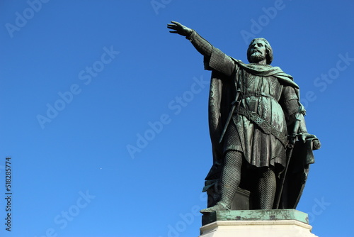 Statue of the famous rebel leader Jacob van Artevelde, known as The Wise Man, in Ghent against a clear blue background (Ghent, East Flanders, Belgium)