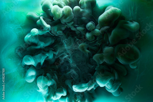 Liquid fluid art abstract background. Blue green acrylic paint underwater, galactic smoke ocean