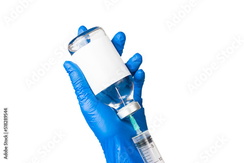 The process of drawing the drug into a syringe. Syringe in the hands of a doctor.