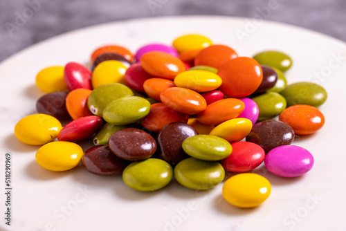 Colorful candies or bonbon. Chocolate filled candy on a dark background. close up