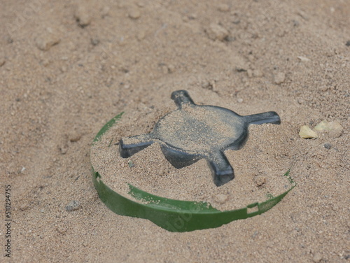 russian anti-personnel mine buried in the sand