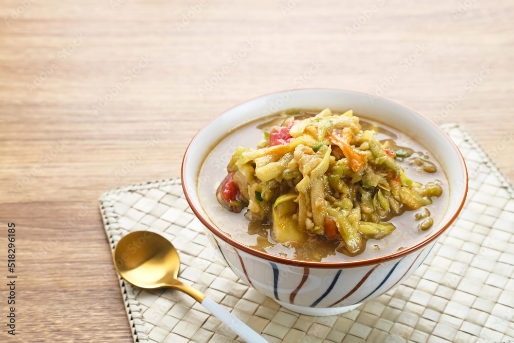 Rujak Serut, Indonesian fruit salad made from grated variety of fresh fruits and mixed with a sauce made of brown sugar, chili, salt and peanuts.
Rujak Serut, Indonesian fruit salad made from grated variety of fresh fruits and mixed with a sauce made of brown sugar, chili, salt and peanuts.