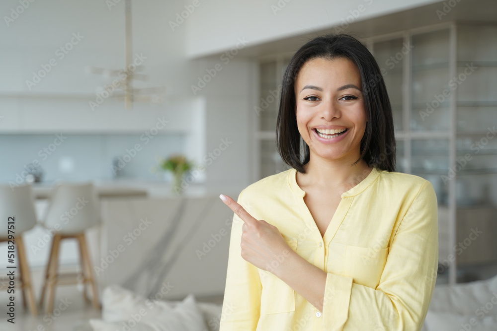 Happy woman handsome girl points with finger to copy space. Advertising banner mockup.