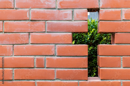 brick wall with a hole in the form of a cross