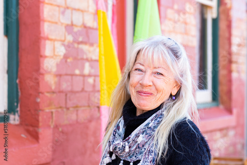 mature woman with long hair head and shoulders view looking at camera photo